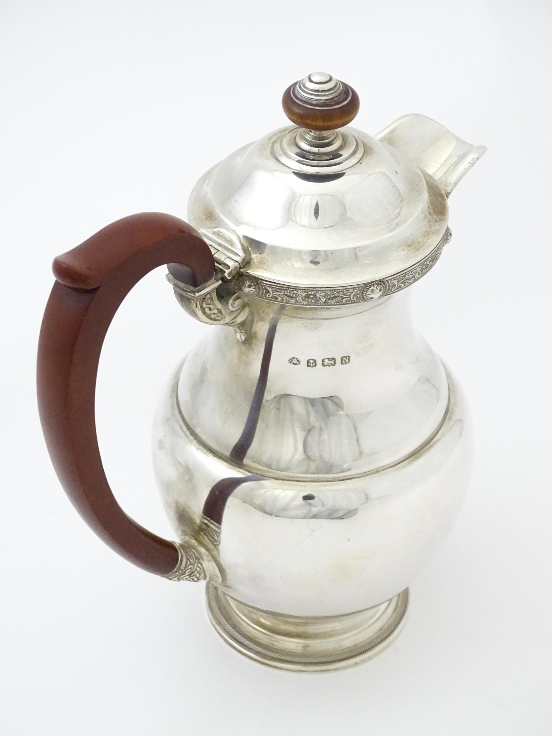 A three piece silver tea set comprising teapot, hot water pot and cream jug, with Celtic style - Image 10 of 20