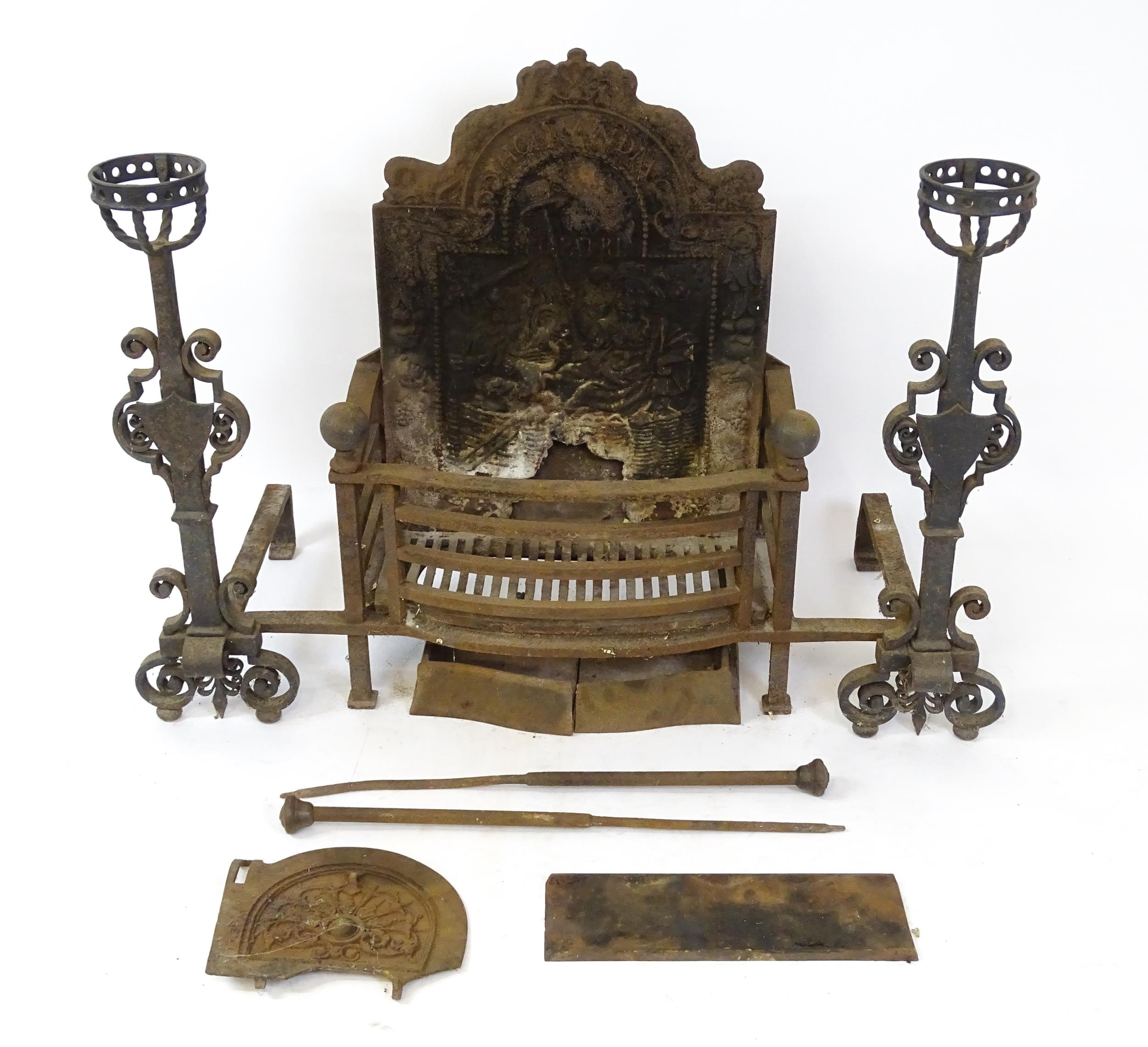 A large cast iron fire basket, the back decorated with figure and lion, marked 'Hollandia Pro