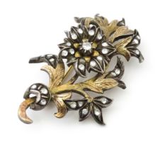 A Victorian brooch of floral sprig form set with white stones Approx 2 1/2" long Please Note - we do