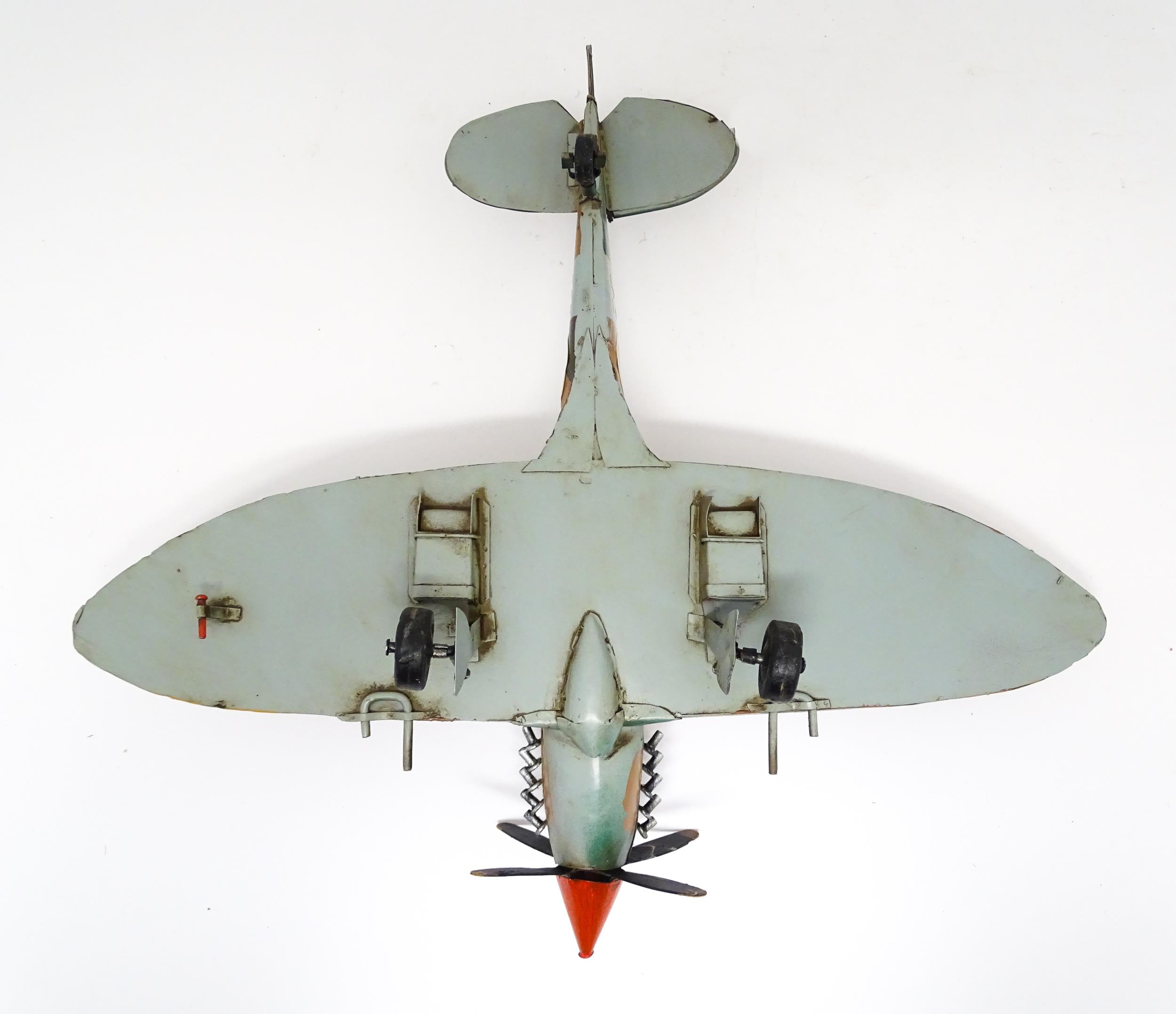 A 20thC scratch built tin plate scale model of a spitfire. Approx. 18" wide Please Note - we do - Image 9 of 10