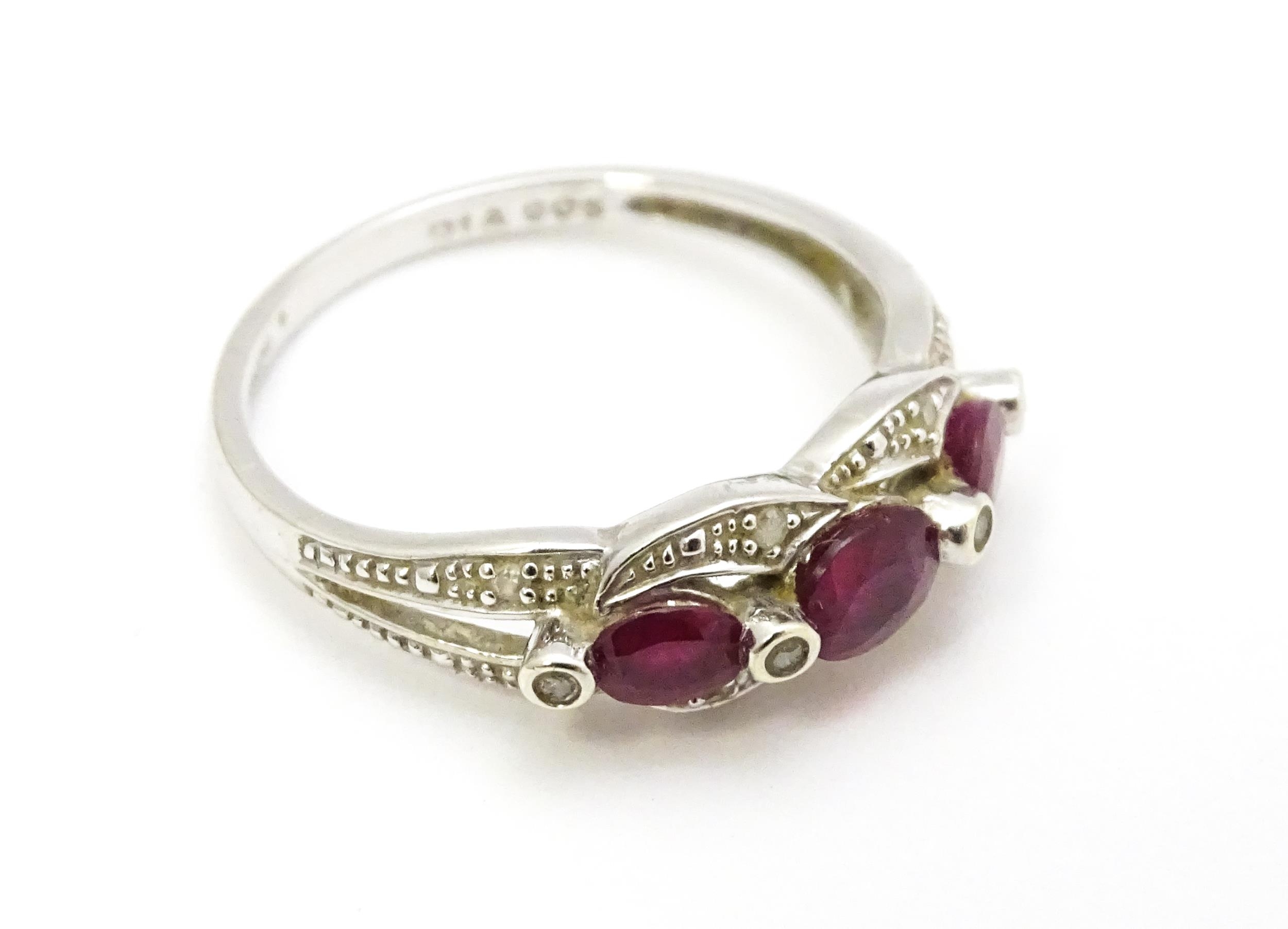 A 9ct white gold ring set with rubies and diamond. Ring size approx. M 1/2 Please Note - we do not - Image 5 of 7