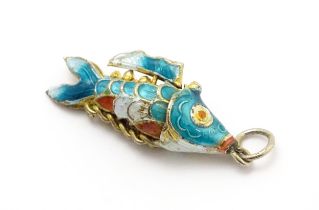 A pendant formed as an articulated fish with enamel detail. Approx 1 1/4" long Please Note - we do