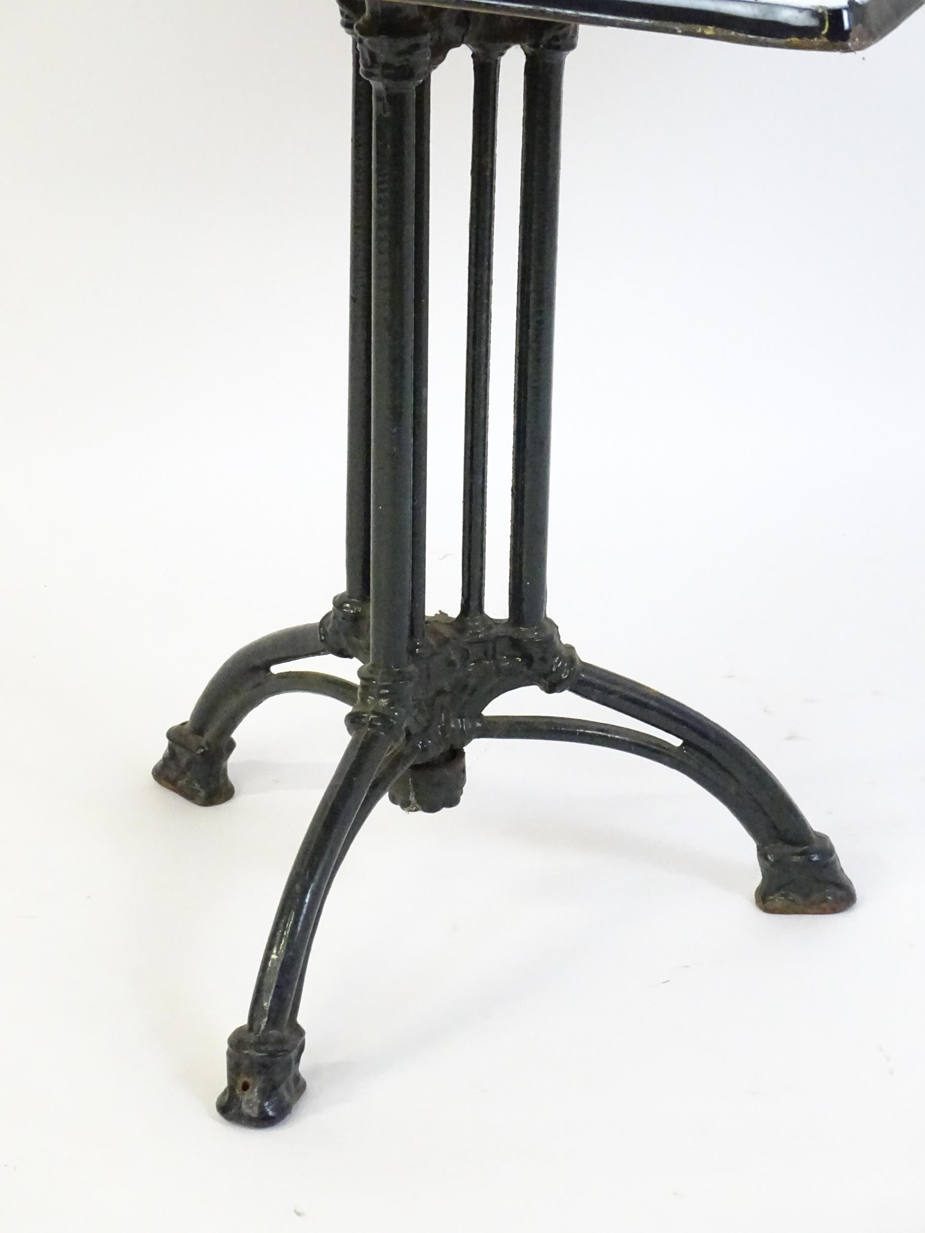 An early 20thC cast iron based pub / cafe / bistro table, with squared advertising top marked - Image 11 of 12