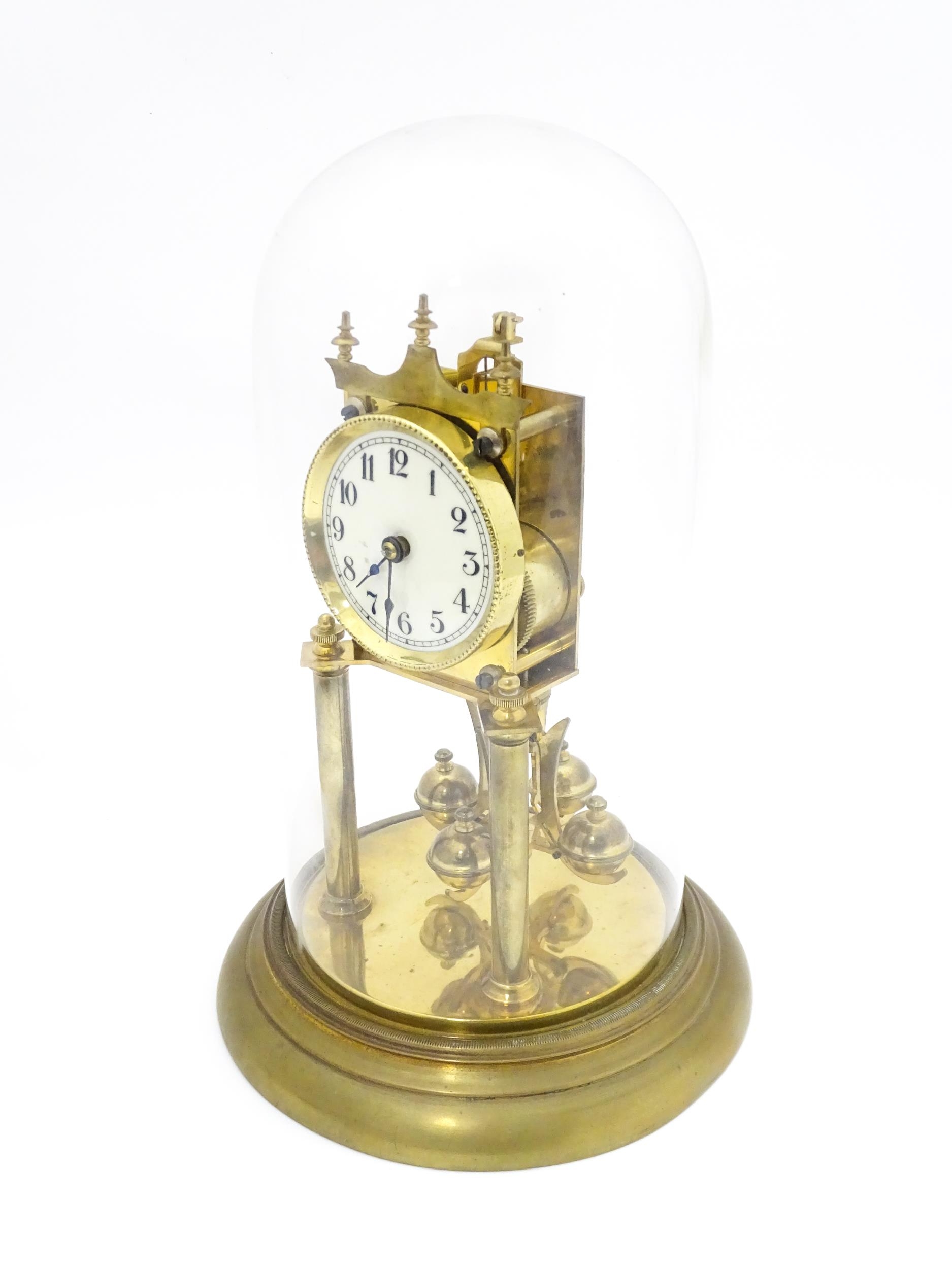 A 20thC anniversary / table clock with white enamel dial and Roman numerals. Under glass dome - Image 11 of 12