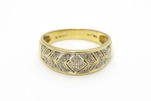 A 14ct gold ring set with diamonds. Ring size approx. P 1/2 Please Note - we do not make reference