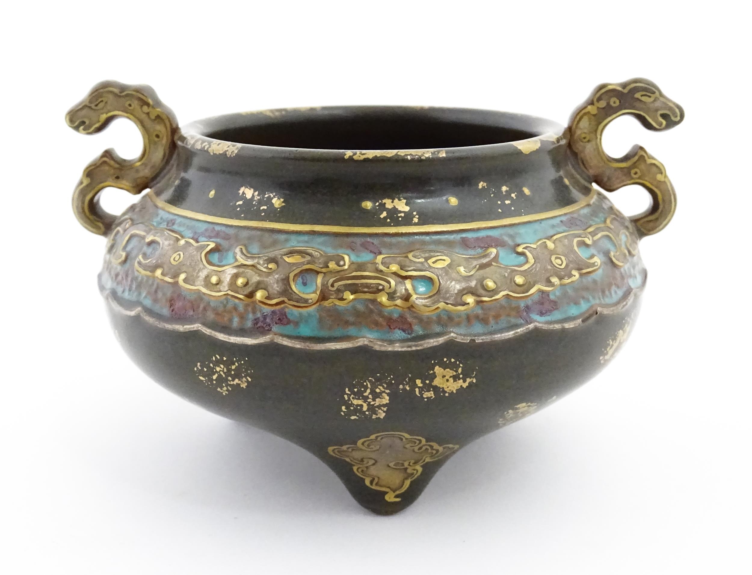 A small Chinese censer with twin handles with banded decoration in relief depicting stylised dragons - Image 6 of 8