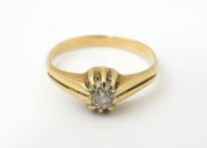 A gold ring set with diamond solitaire. Ring size approx. M Please Note - we do not make reference