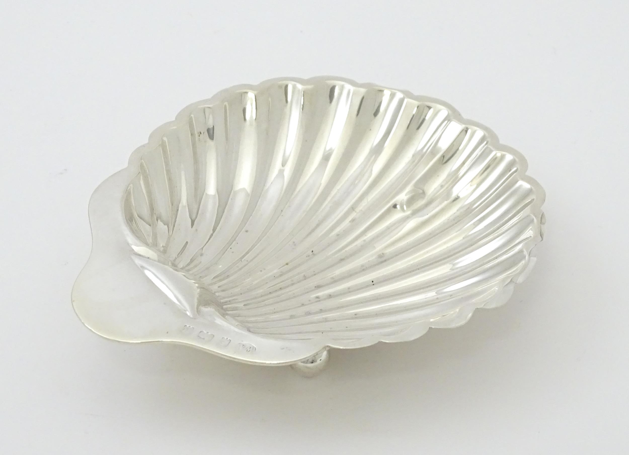 A silver butter dish of scallop shell form hallmarked Birmingham 1902, maker William Aitken. Approx. - Image 3 of 7
