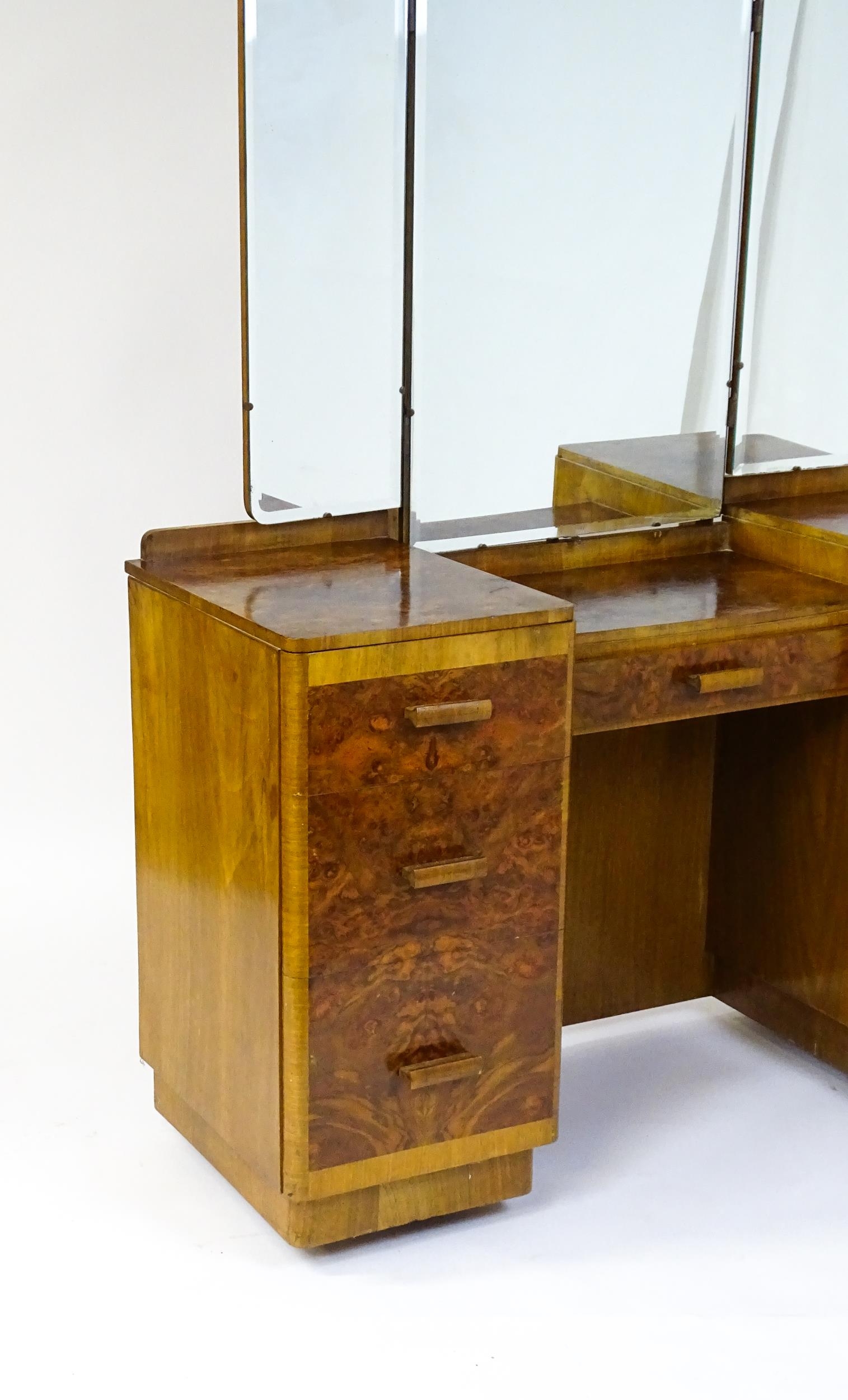A mid 20thC Art Deco style burr walnut veneered dressing table with a triptych mirror above a - Image 5 of 9