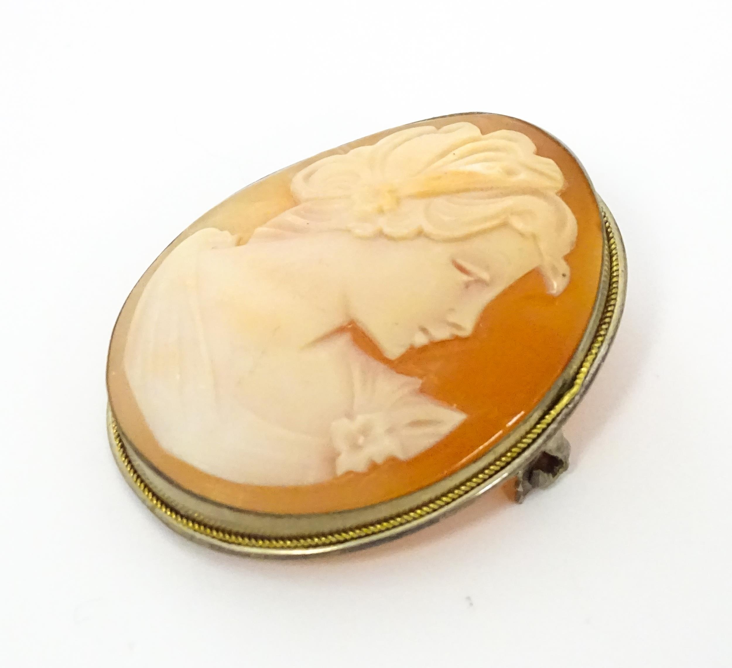 Two cameo brooches, one a classical cameo set within a .800 silver mount. The other a Victorian - Image 7 of 11