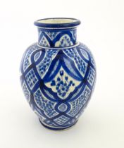 A Continental blue and white vase of baluster form with brushwork decoration. Approx. 9 1/4" high