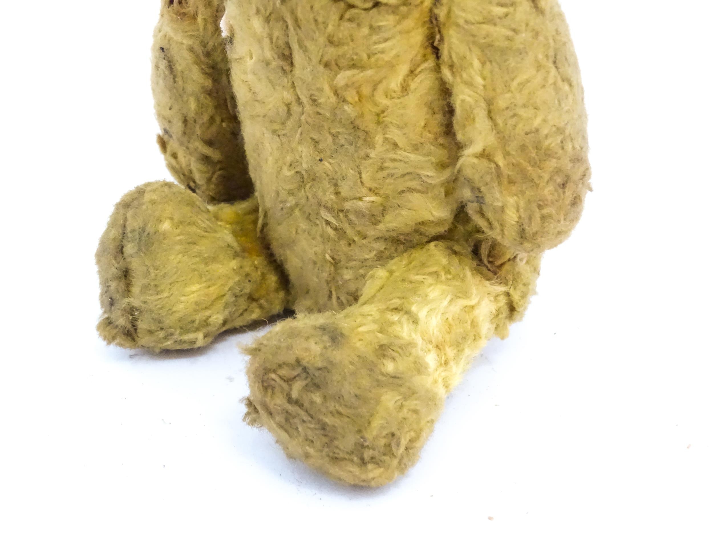 Toy: An early 20thC straw filled teddy bear with stitched nose and articulated limbs. Approx. 7" - Image 5 of 7