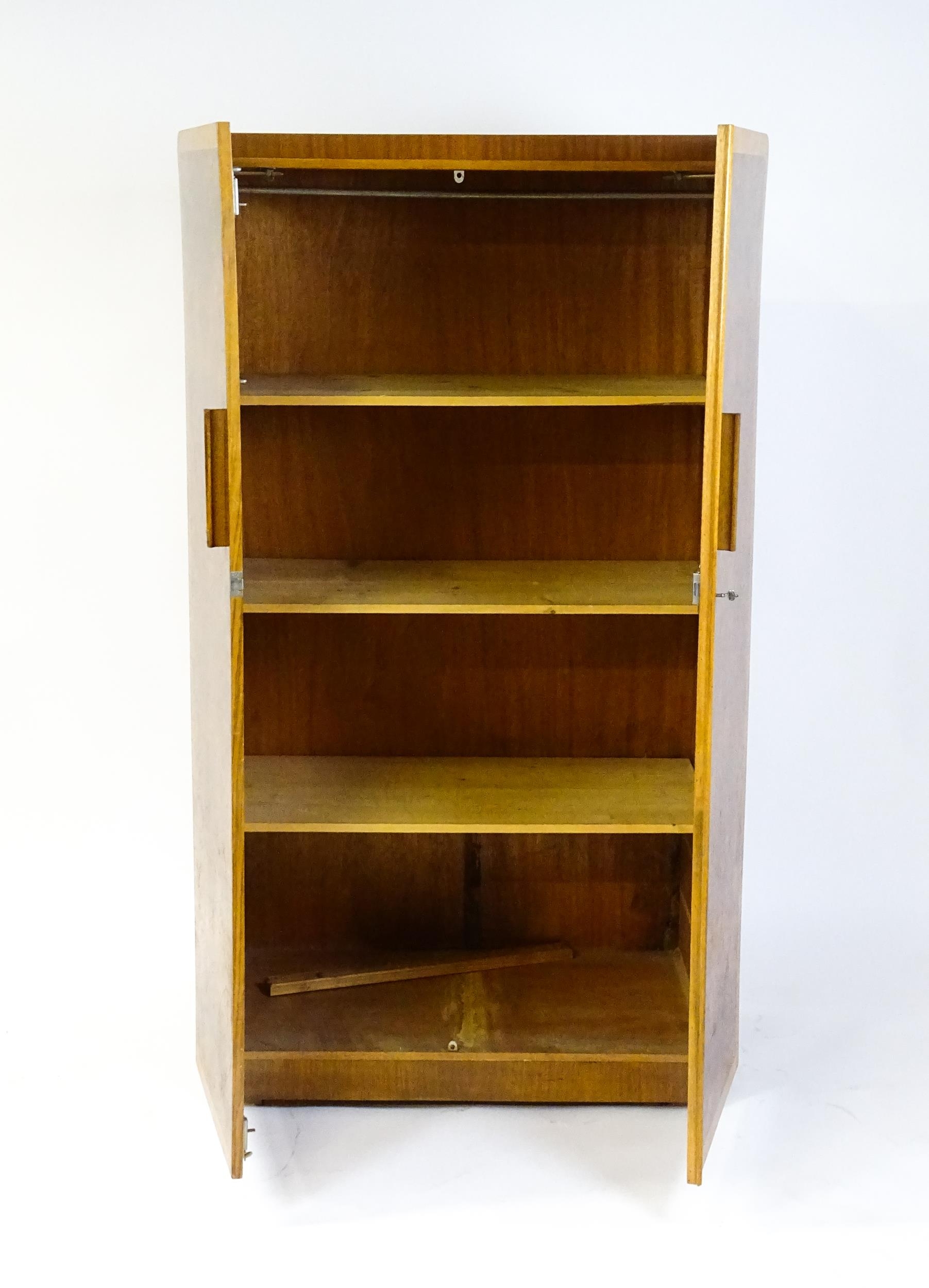 A mid 20thC Art Deco style wardrobe / cupboard with burr walnut veneered doors and shaped handles. - Image 4 of 7