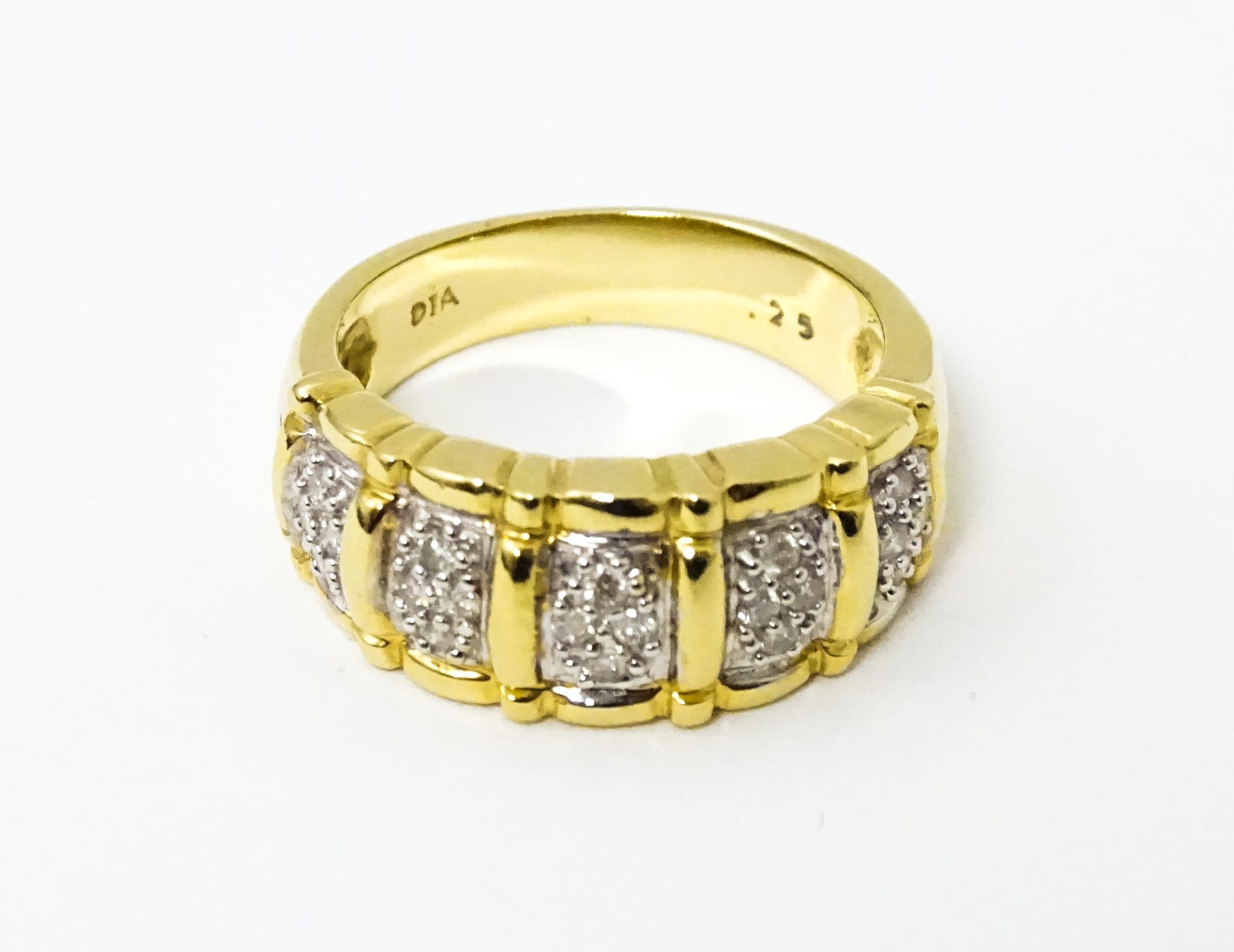 A 14ct gold ring set with diamonds. Ring size approx. M 1/2 Please Note - we do not make reference