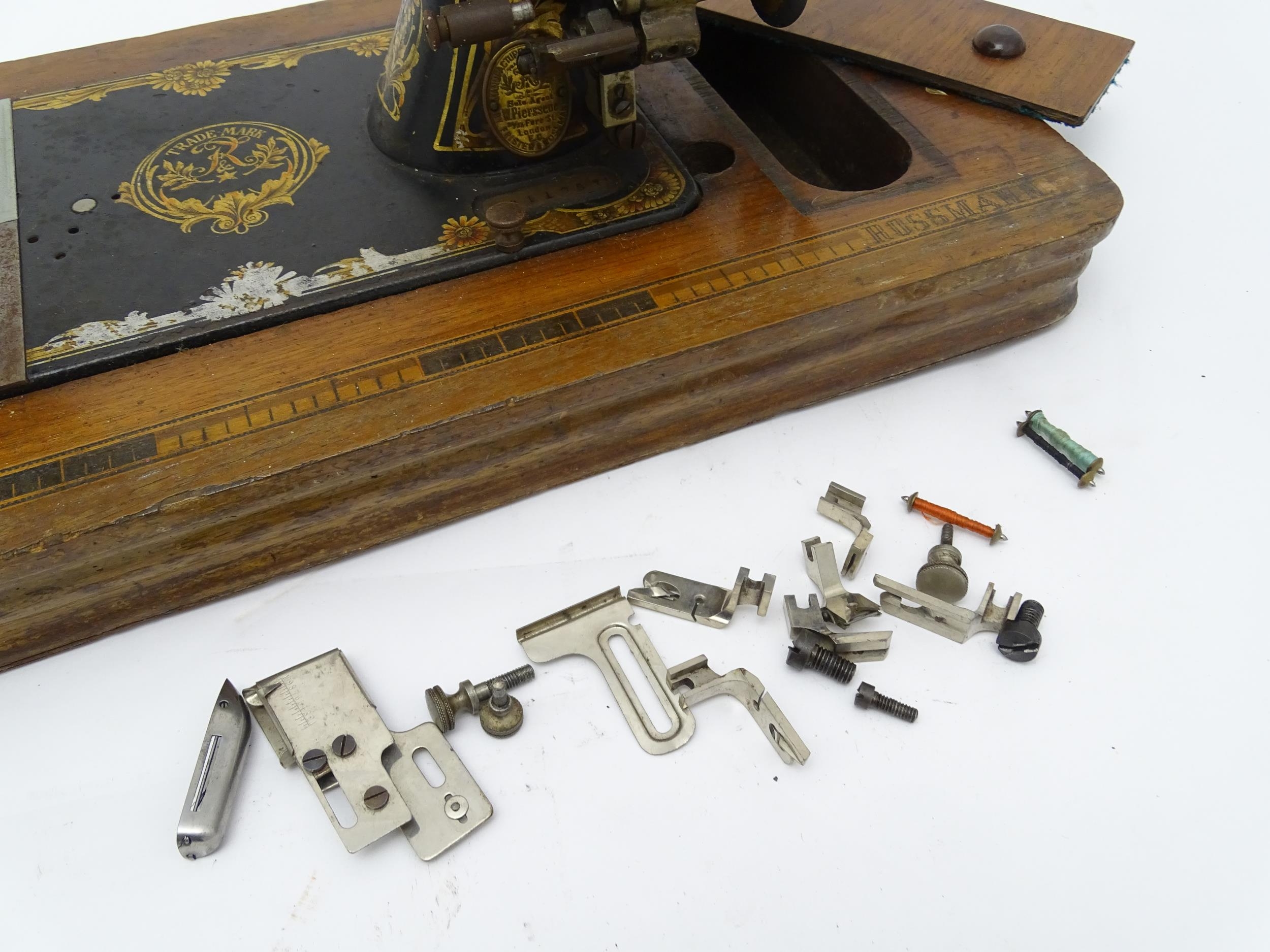 An early 20thC Frister & Rossmann hand crank sewing machine with floral and foliate decoration. - Image 10 of 15