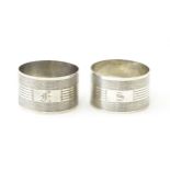 A pair of silver napkin rings with engine turned decoration, marked sterling (2) Please Note - we do