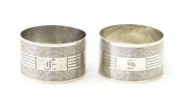 A pair of silver napkin rings with engine turned decoration, marked sterling (2) Please Note - we do