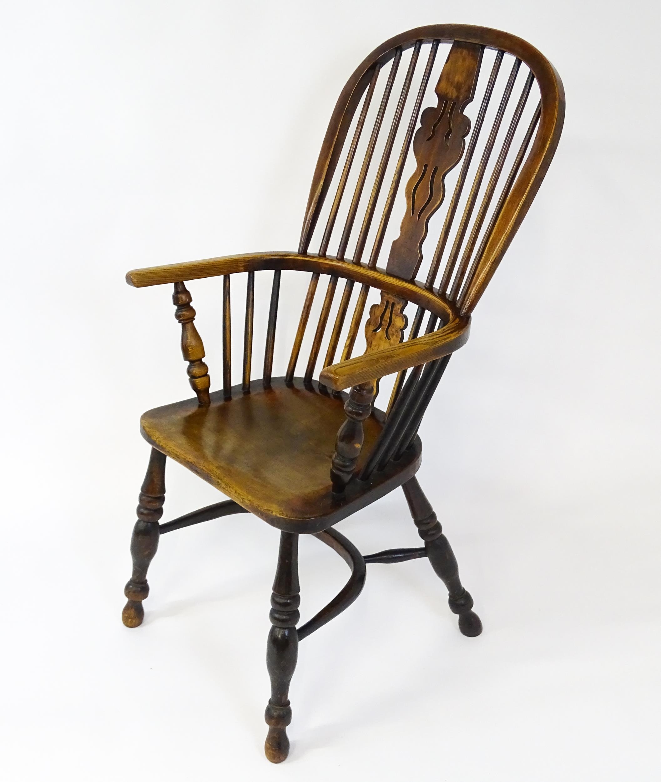 A mid 19thC ash and elm Windsor chair with a double bowed backrest and a pierced back splat above - Image 4 of 9