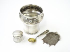 A silver pot of tapering form with embossed decoration, hallmarked London 1904, maker Edward Barnard