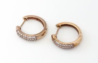 A pair of 9ct rose gold earrings set with diamonds Please Note - we do not make reference to the