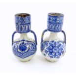 Two blue and white oil jars / berrada style vases with twin handles, decorated with brushwork