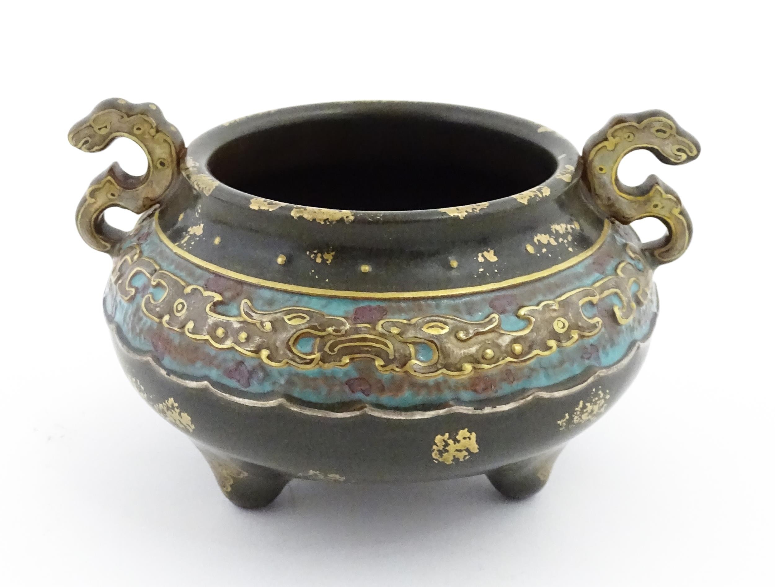 A small Chinese censer with twin handles with banded decoration in relief depicting stylised dragons - Image 4 of 8