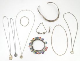 A quantity of assorted silver and white metal jewellery to include necklaces, pendants, charm