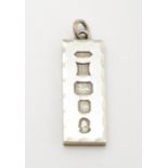 A silver pendant of ingot form hallmarked Birmingham 1977 with Silver Jubilee mark. Approx. 1 7/8"