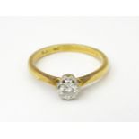 An 18ct gold ring set with diamond solitaire. Ring size approx. M 1/2 Please Note - we do not make