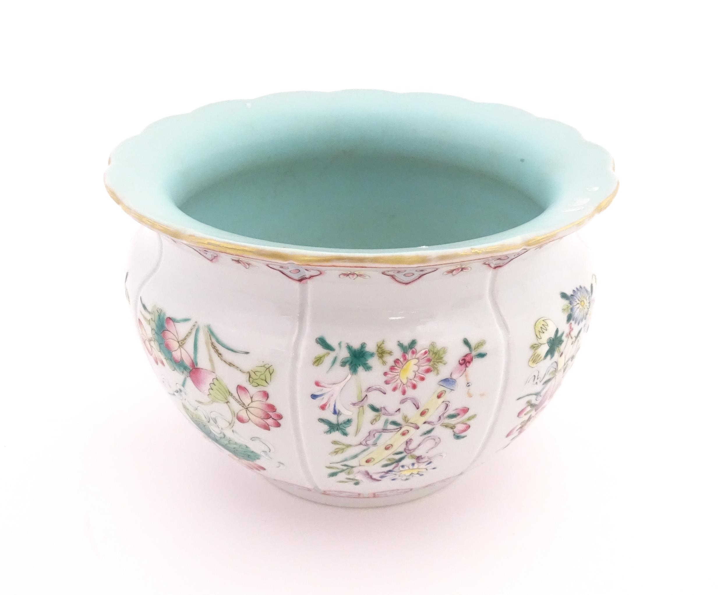 A Chinese famille rose bowl with scalloped edge decorated with flowers, foliage and scrolls. - Image 5 of 8