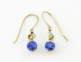 A pair of silver gilt drop earrings set with tanzanites. Approx. 1/2" long Please Note - we do not