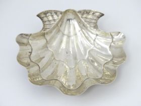 A .925 silver dish of scallop shell form, with indistinct maker's mark. Approx. 7" wide Please