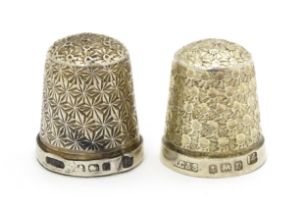 Two silver thimbles, one hallmarked Birmingham 1927, the other hallmarked Birmingham 1928, both by