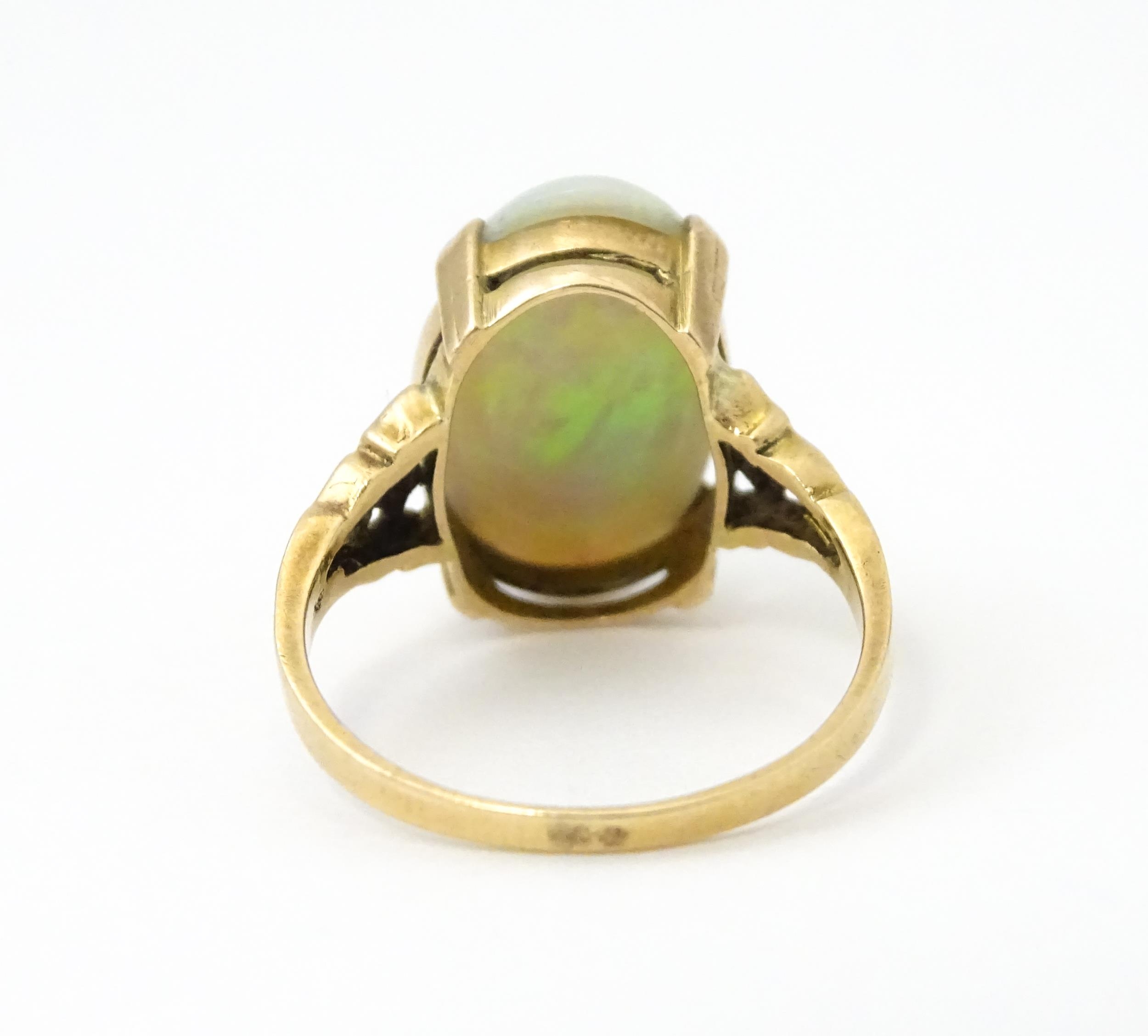 A 9ct gold ring set with large opal cabochon. The opal approx 3/4" long. Ring size approx. 0 - Image 7 of 10