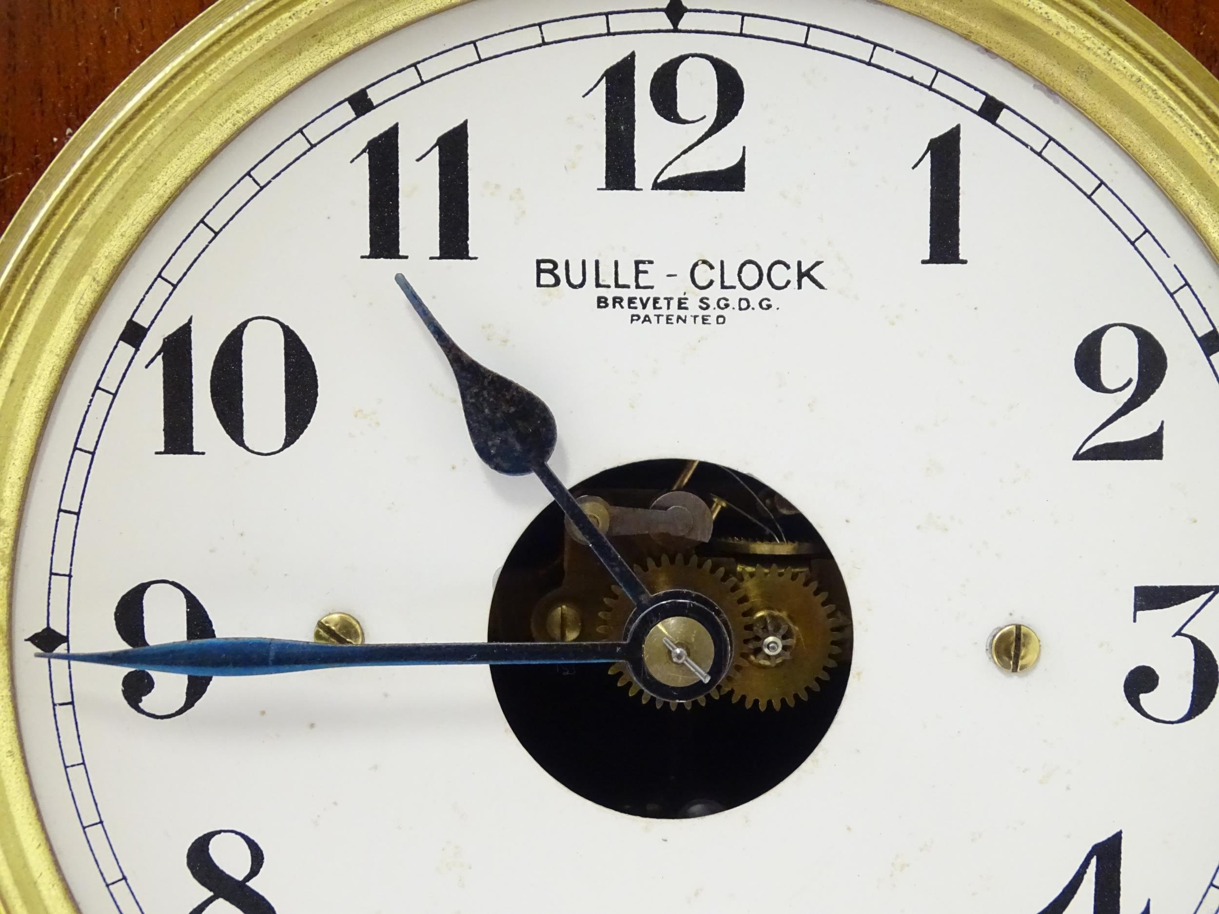 Bulle - Clock : A French mahogany cased electric mantel clock by Bulle. Model BC. The case decorated - Image 6 of 9