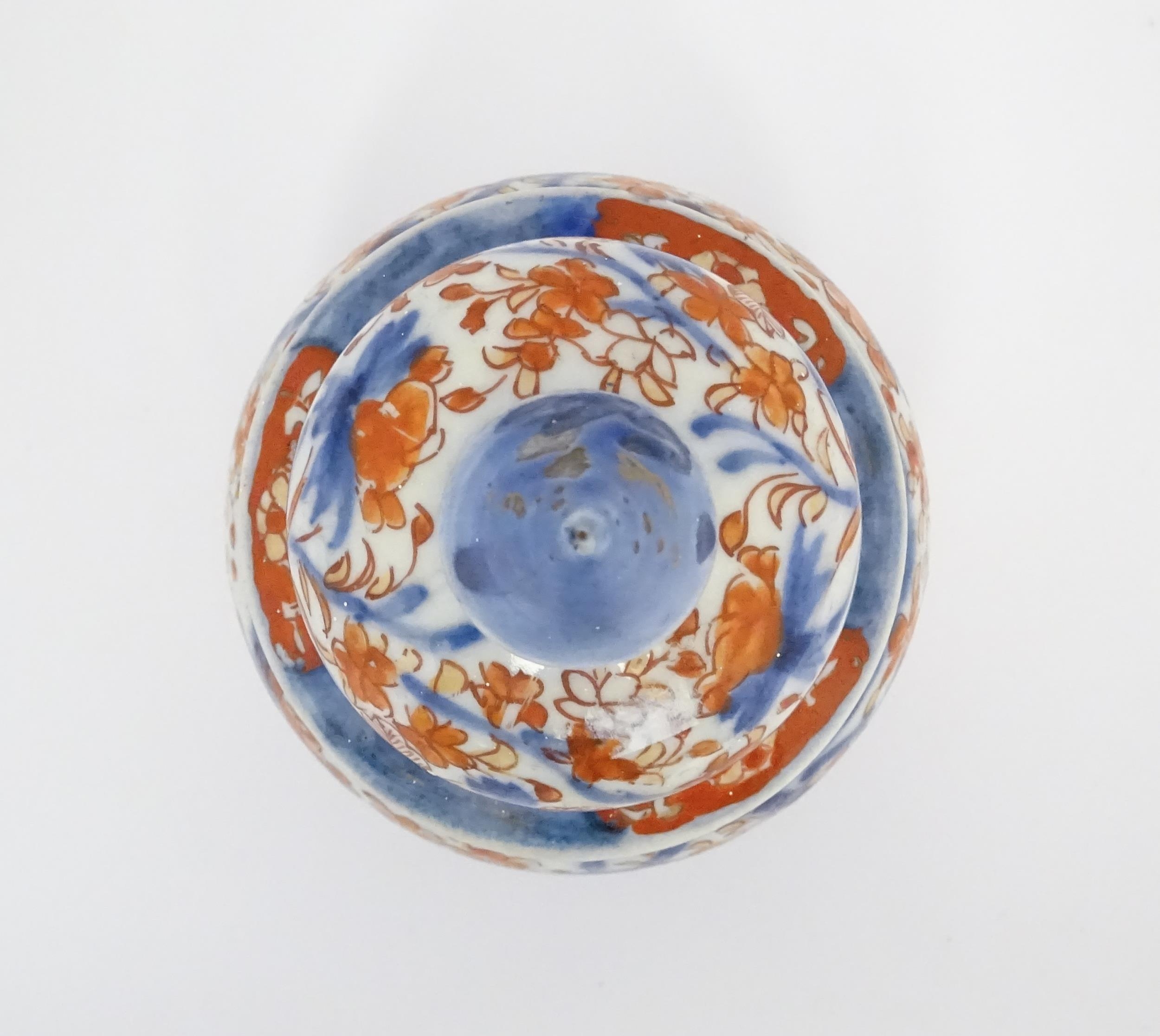 An Oriental ginger jar decorated in the Imari palette with flowers and foliage. Approx. 7 1/2" - Image 7 of 7