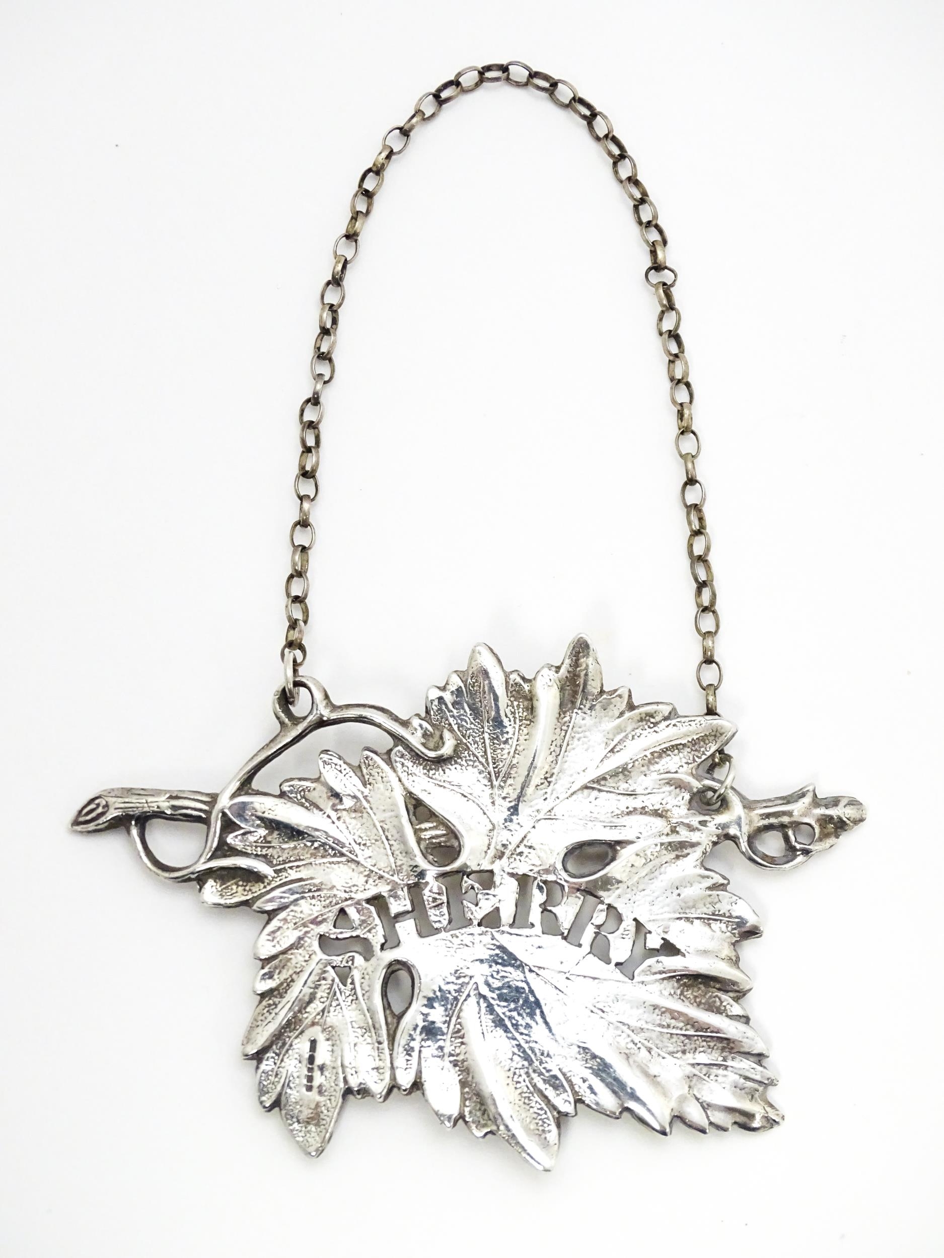 A silver wine / decanter label / bottle ticket for Sherry of vine leaf form, hallmarked Birmingham