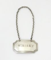 A silver wine / decanter label / bottle ticket engraved 'Whisky' and hallmarked Birmingham 1968,