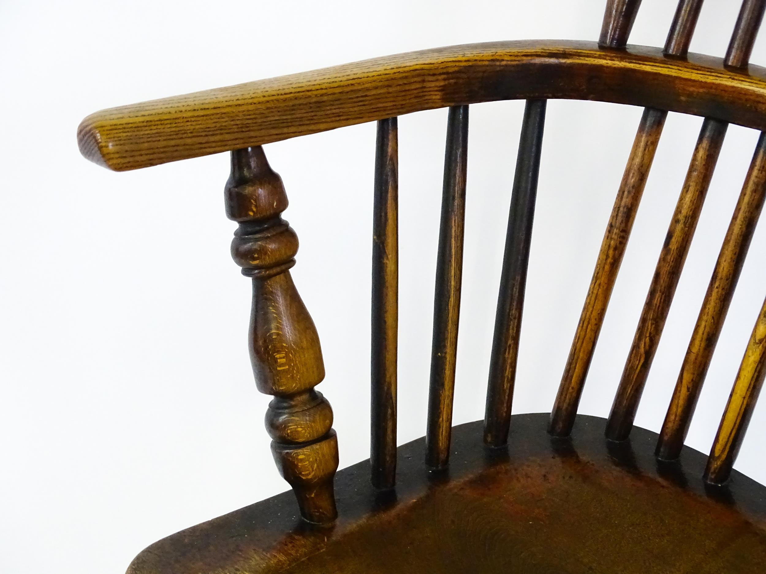 A mid 19thC ash and elm Windsor chair with a double bowed backrest and a pierced back splat above - Image 7 of 9