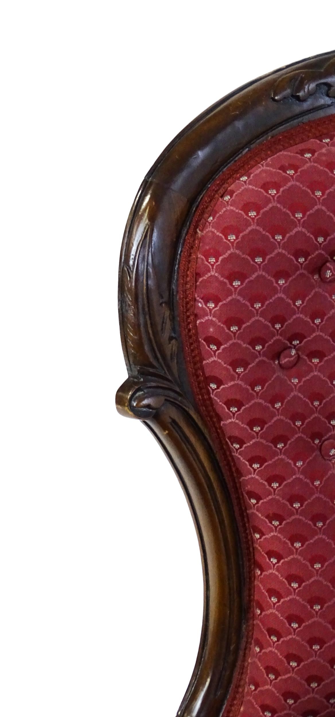 A late 19thC / early 20thC nursing chair with a deep buttoned spoon back adorned with a carved - Image 6 of 7