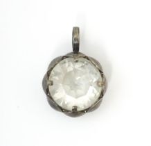 A Scandinavian silver pendant set with facet cut white stone to centre. Stamped with anvil mark