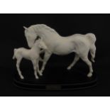 A Royal Doulton model Spirit of Affection depicting white horse and foal. Marked under, and having