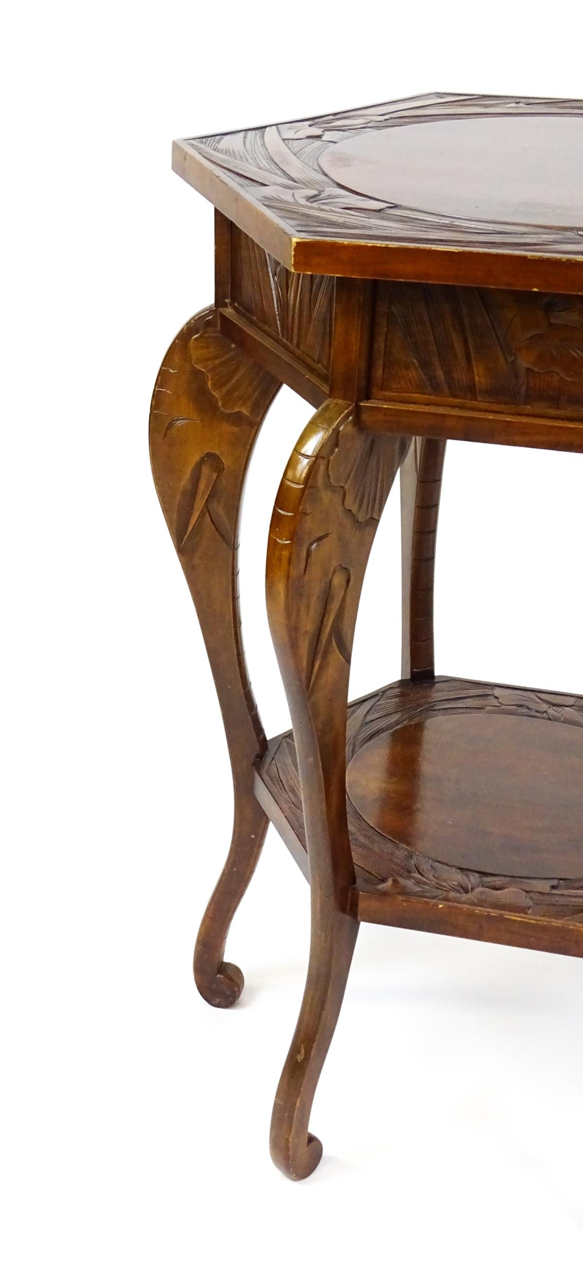 An early / mid 20thC table in the manner of Liberty of London in the Japanese style. with a carved - Image 4 of 9