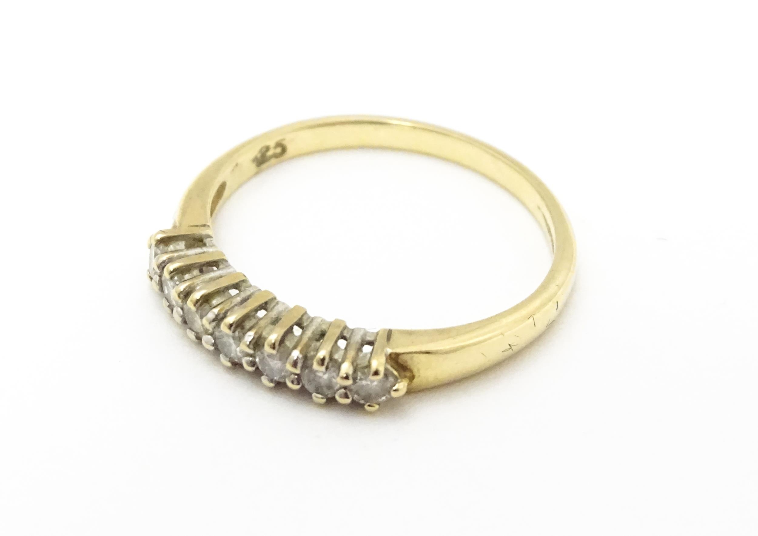 A 9ct gold ring set with seven diamonds in a linear setting. Ring size approx. K 1/2 Please Note - - Image 4 of 7