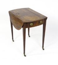 An early 19thC mahogany Pembroke table with a crossbanded top and two demi lune leaves above a