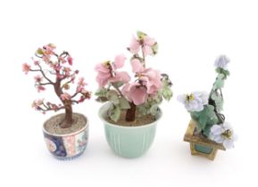 Three Chinese models of bonsai trees, with hardstone flowers / blossom detail, one in a celadon