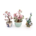 Three Chinese models of bonsai trees, with hardstone flowers / blossom detail, one in a celadon