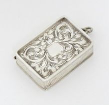 A Victorian silver vinaigrette with engraved acanthus scroll decoration. hallmarked Birmingham