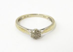 A 9ct gold ring set with diamond cluster. Ring size approx. P 1/2 Please Note - we do not make