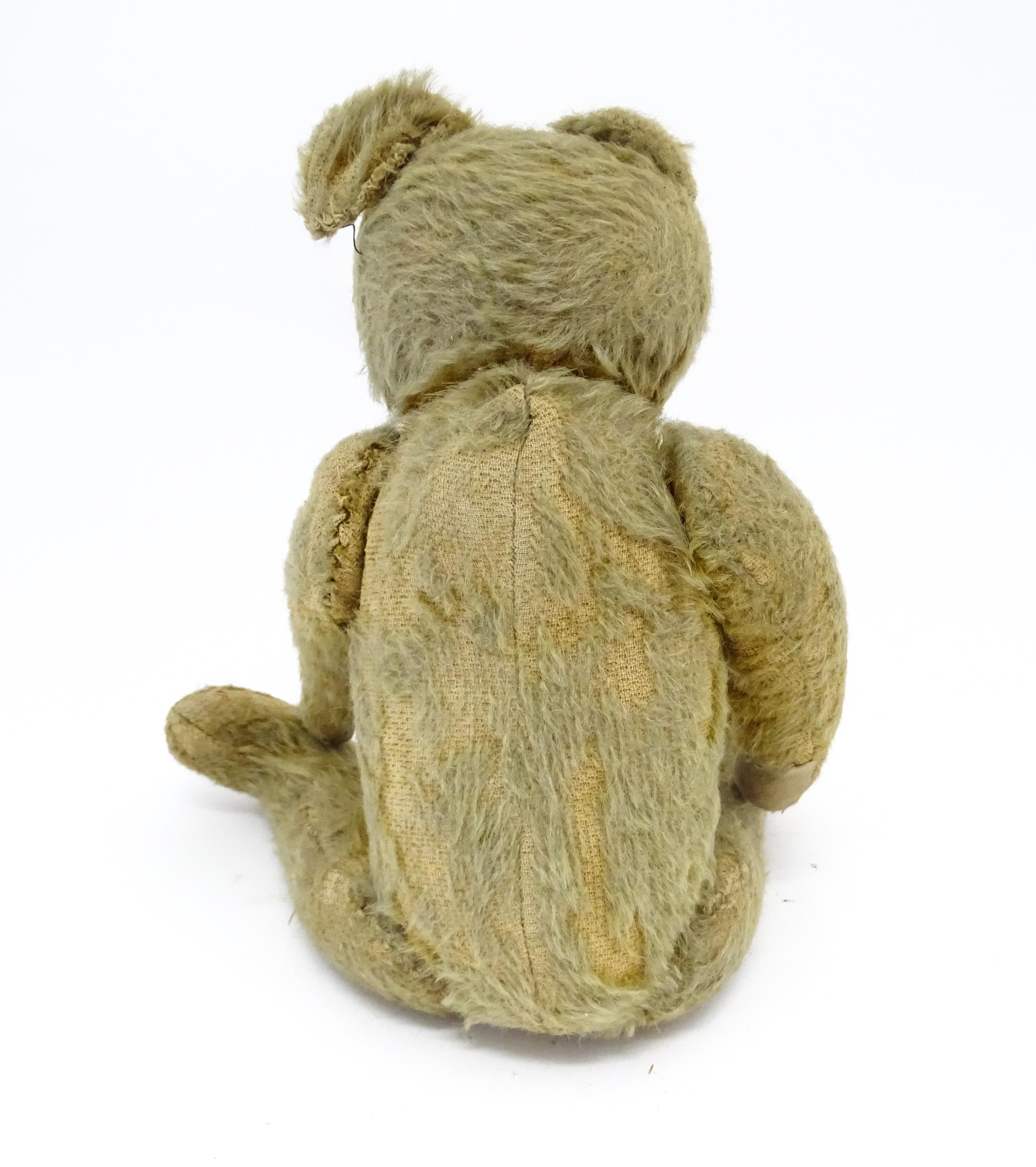 Toy: An early 20thC mohair straw filled teddy bear with proud nose, stitched mouth, hump back, - Image 3 of 9